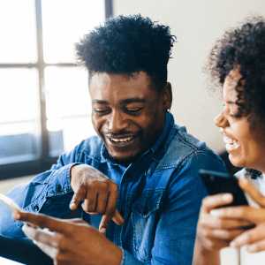 Man and woman on smart home devices